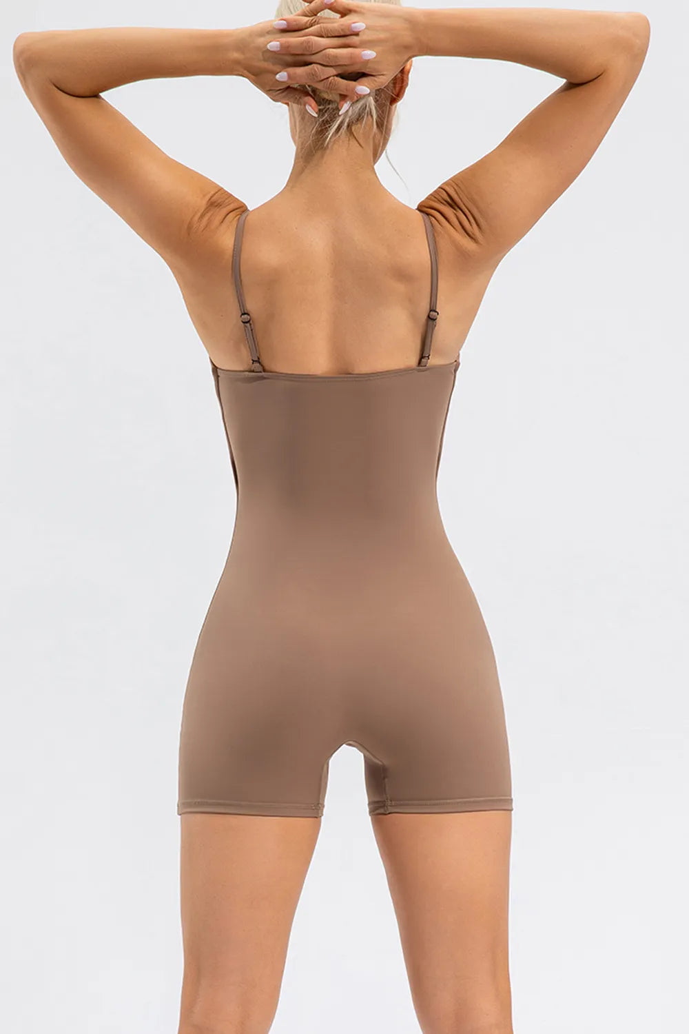 Trendsi spaghetti strap round neck activewear romper with sleeveless design and relaxed fit, perfect for casual and workout wear.