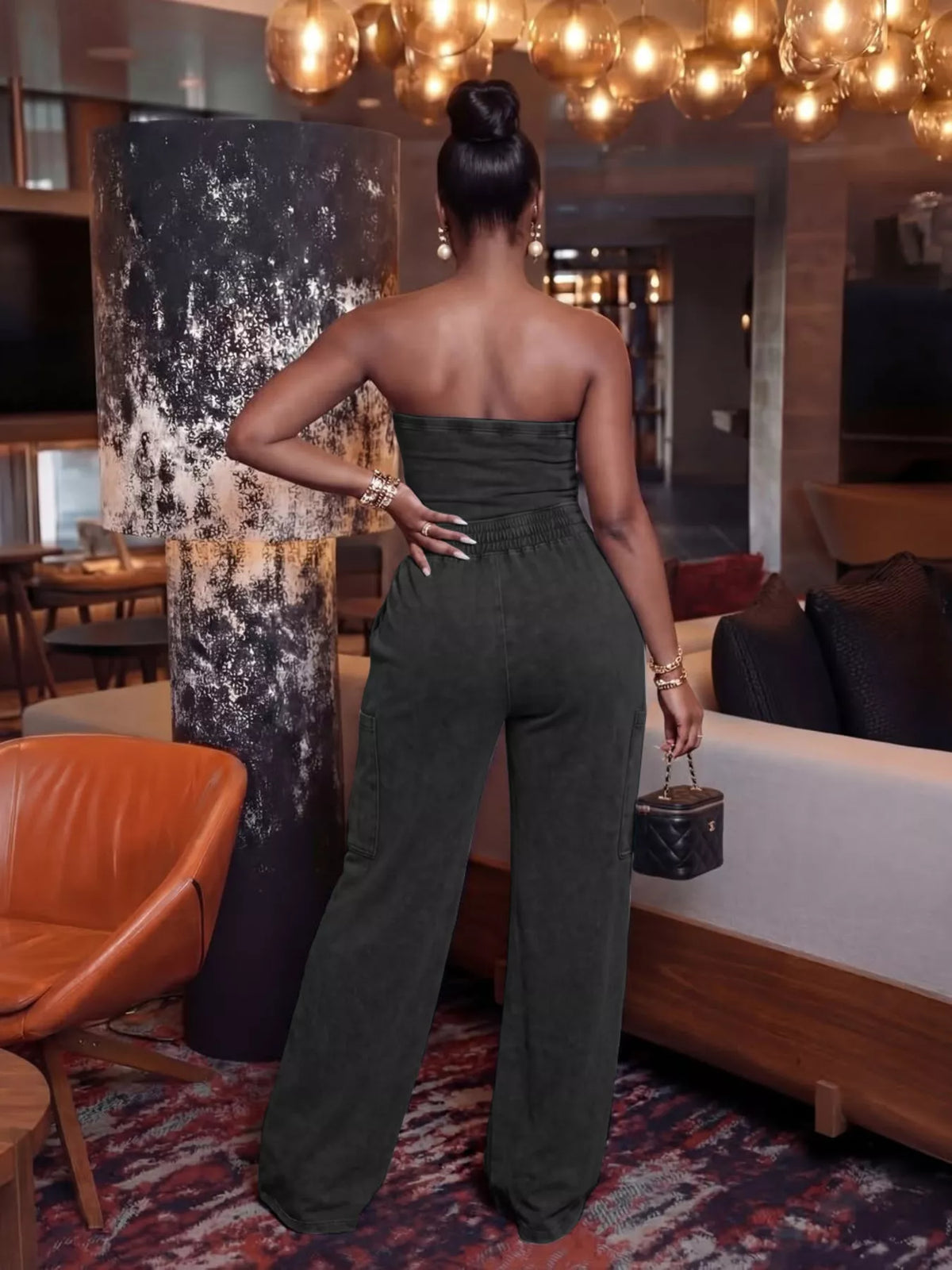 Strapless wide-leg jumpsuit with drawstring waist from Plush Fashion Hub, stylish playsuit in a lightweight, flowy fabric.