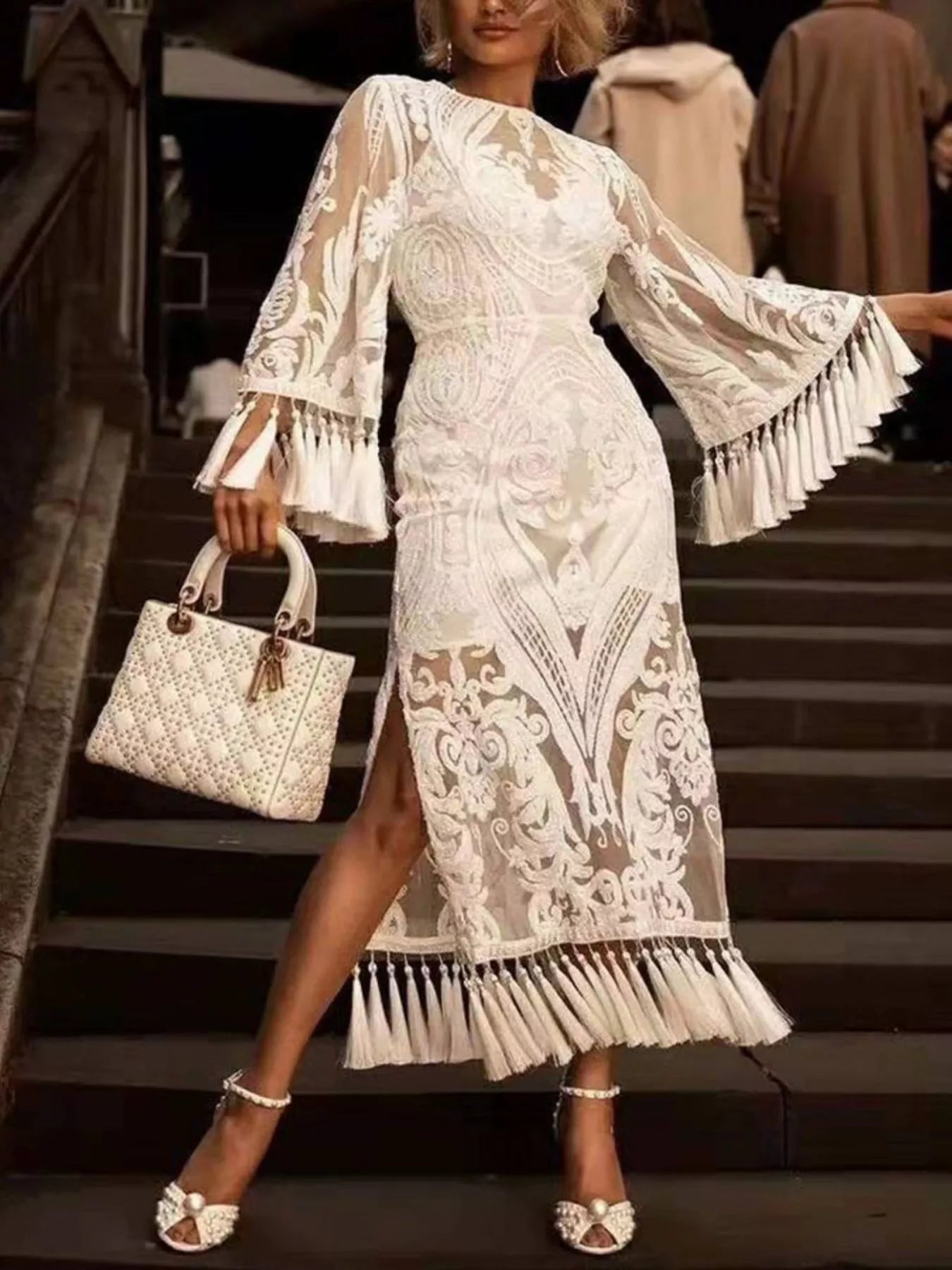 Plus size lace flare sleeve dress with tassel hem from Plush Fashion Hub, featuring a stylish full-length design and intricate lace details.
