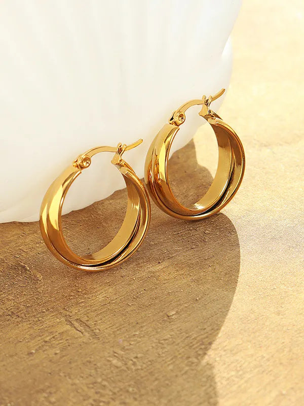 18K gold-plated titanium steel huggie earrings with a sleek, polished finish, featuring a secure clasp for comfortable wear.