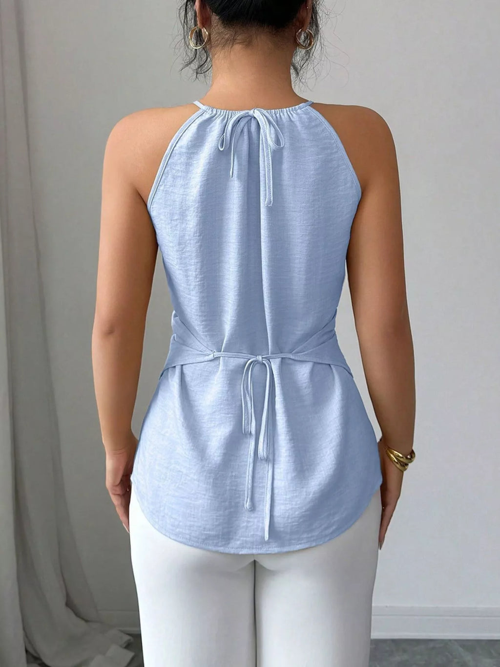 Plush Fashion Hub halter neck crisscross cami tank top with stylish straps and fitted design, shown on a mannequin.
