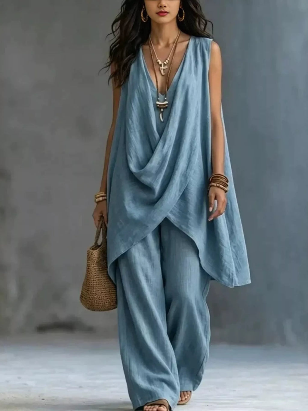 Sleeveless asymmetrical top and wide-leg pants set by Plush Fashion Hub, featuring stylish, modern design in neutral fabric.