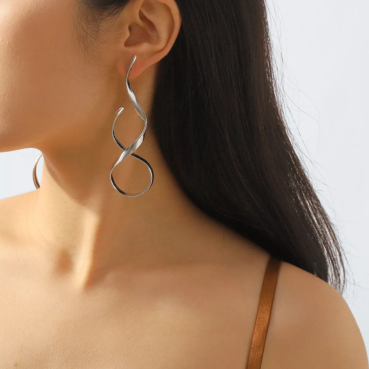 Silver alloy spiral drop earrings by Shopimist featuring sleek, curved design hanging from hooks