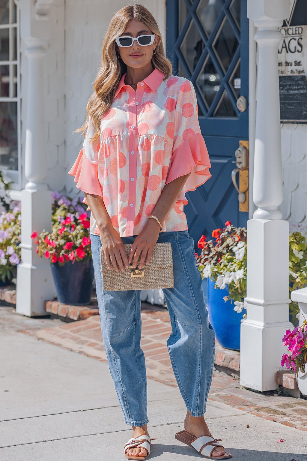 Angelica short sleeve babydoll blouse by Threaded Pear featuring lightweight fabric and a relaxed fit, shown on a model.