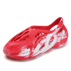 Trendsi hollow-out flat sandals with open toe design, stylish footwear featuring cut-out details and ankle straps.