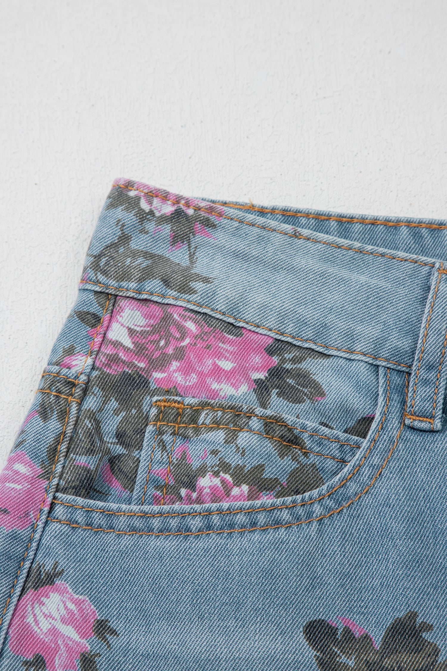 Esme floral print bootcut jeans by Threaded Pear featuring vibrant floral patterns and classic denim fit.