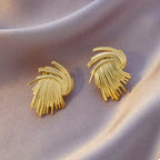 Gold-plated textured stud earrings with a sleek design, featuring 18K gold finish and minimalistic style.