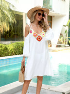Crochet trim cold shoulder cover-up dress by Trendsi, featuring a flowing design with open shoulders and intricate crochet details.