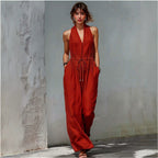 Women's sleeveless halter neck solid color long jumpsuit from Plush Fashion Hub, featuring a casual, relaxed fit and wide-leg design.