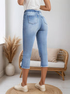 Women’s FitiqueFit casual denim shorts with drawstring waist, featuring distressed details and a relaxed fit.