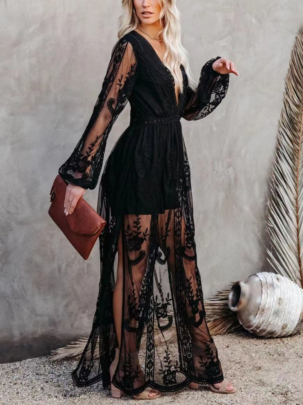 Floral lace high-slit maxi dress by Trendsi featuring elegant design, fitted bodice, and flowing skirt for formal evening events.