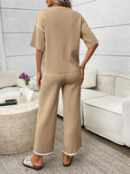 Women's casual two-piece lounge set with round neck top and drawstring pants, stylish and comfortable from Trendsi.