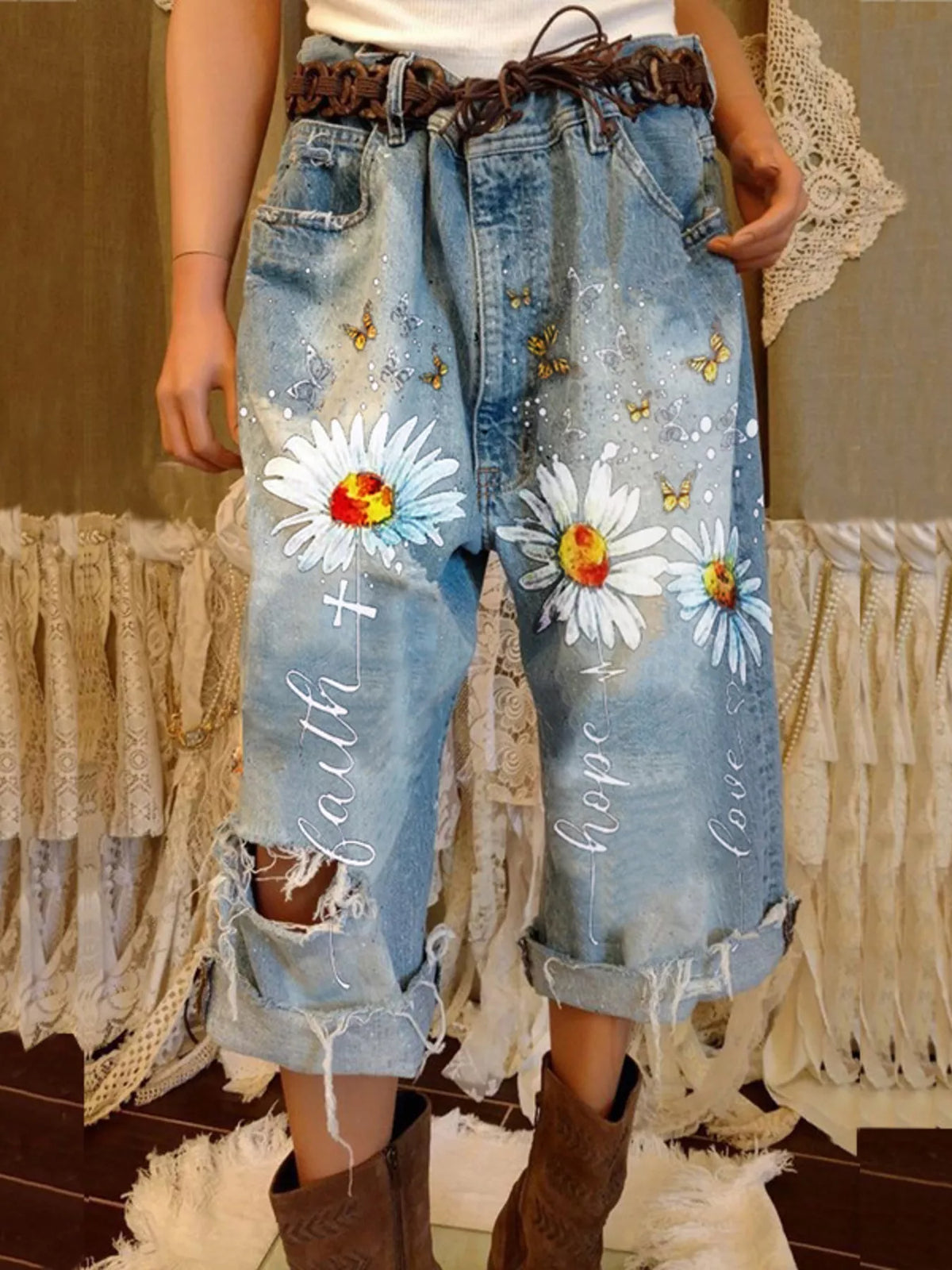 Full size floral distressed cropped jeans by Trendsi, featuring a plus size fit with floral embroidery and worn-in denim style.