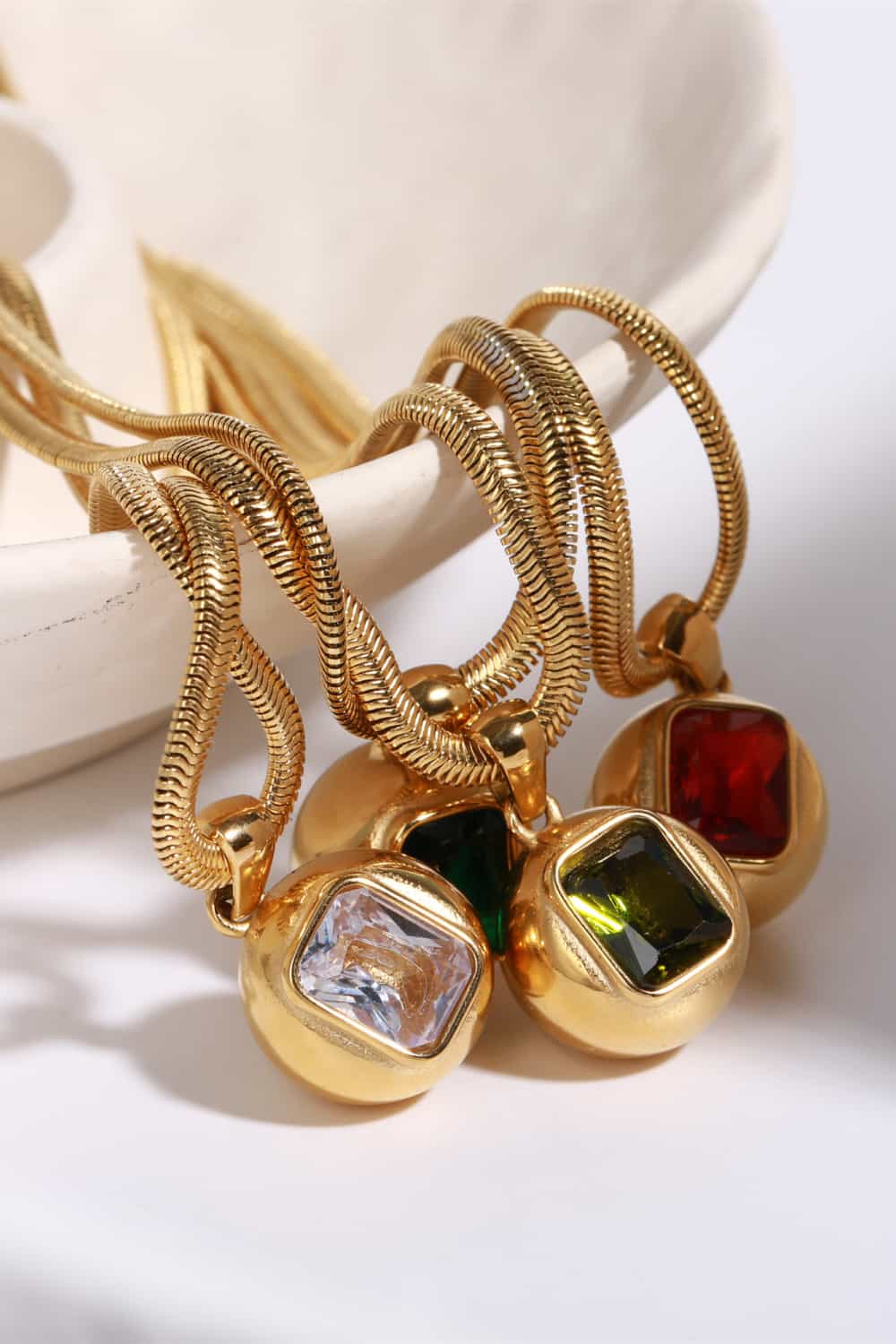 18K gold-plated geometrical zircon pendant necklace with a modern design, showcasing a sparkling zircon stone on a sleek chain.
