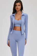 Fitglutes Activewear sports bra, leggings, and zip jacket 3-piece set, featuring cross-back design and athletic fit for workout comfort.