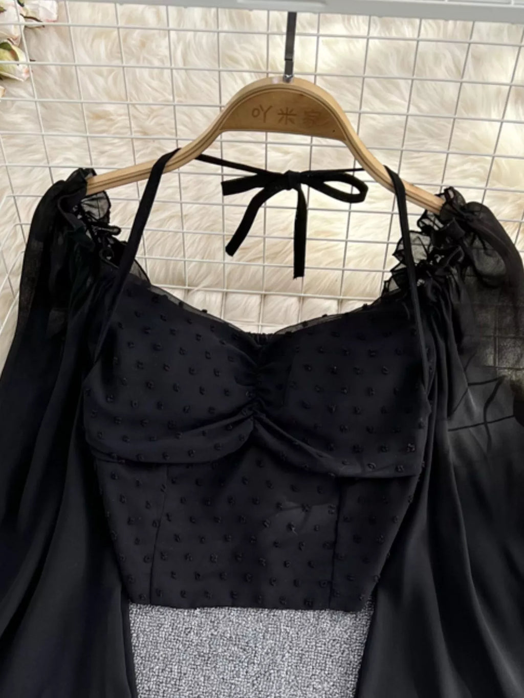 Elegant long sleeve Swiss Dot ruffled flounce sleeve blouse for women, featuring a delicate dress design with intricate details.