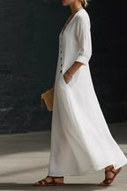Surplice long sleeve maxi dress by Trendsi featuring a flowing silhouette and elegant design, shown on a model.