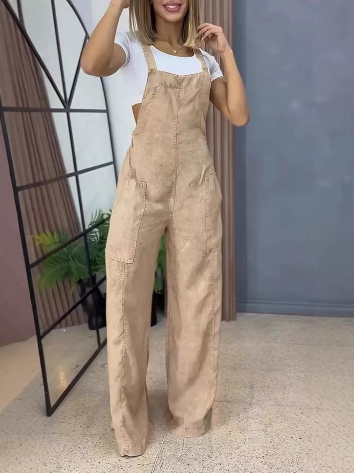 Blue wide-leg denim overalls in a full-size one-piece by Plush Fashion Hub, featuring adjustable straps and front pockets.