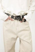 Men's baggy jeans with multiple pockets, trendy relaxed fit, branded by Trendsi, displayed hanging with a casual style.