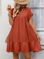 Women's casual V-neck mini dress with ruffle hem and ruched detailing, stylish dress from Trendsi.