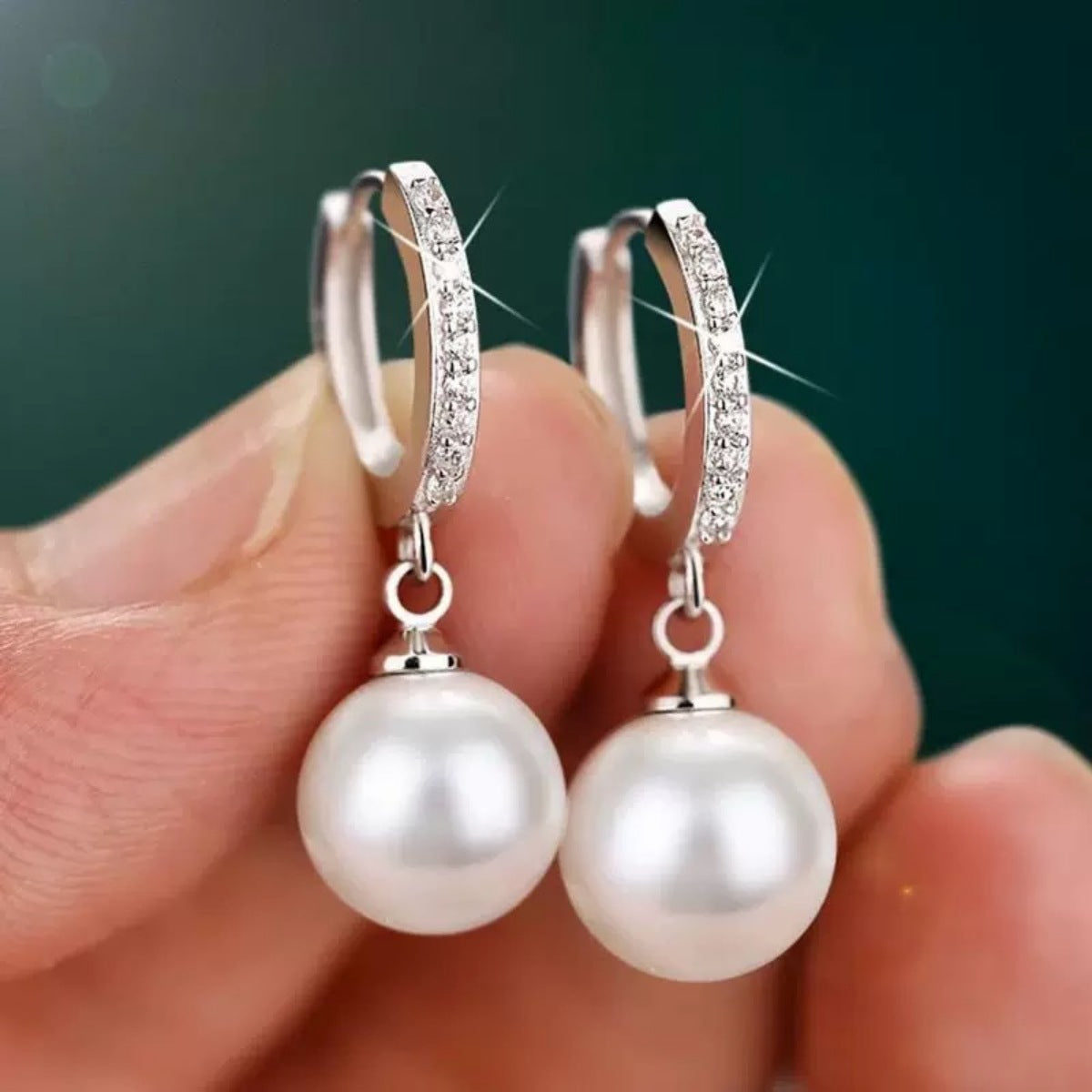 Pearl drop hoop earrings by Plush Fashion Hub featuring elegant pearl accents on gold-toned hoops.
