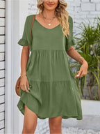 Lightweight rayon mini dress with ruffled sleeves, tiered design, and pockets, perfect for casual summer wear.