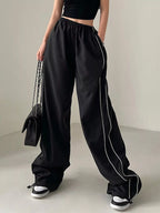 Women's high-rise wide-leg pants by Trendsi, lightweight elastic waist trousers, casual dress style with flowing fabric.