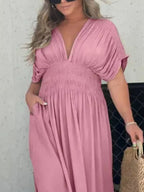 Plus size Trendsi maxi dress with a slit, V-neck, smocked waist, and full-length design, perfect for elegant summer or evening wear.