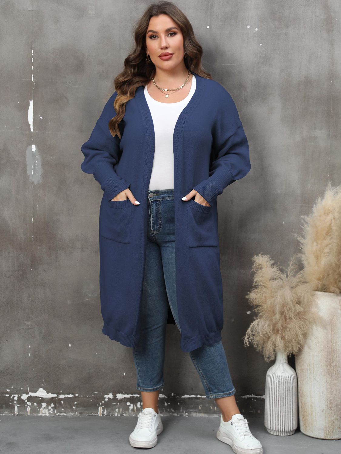 Plus size long sleeve cardigan with pockets by Shopimist, featuring a cozy knit fabric and a relaxed fit.