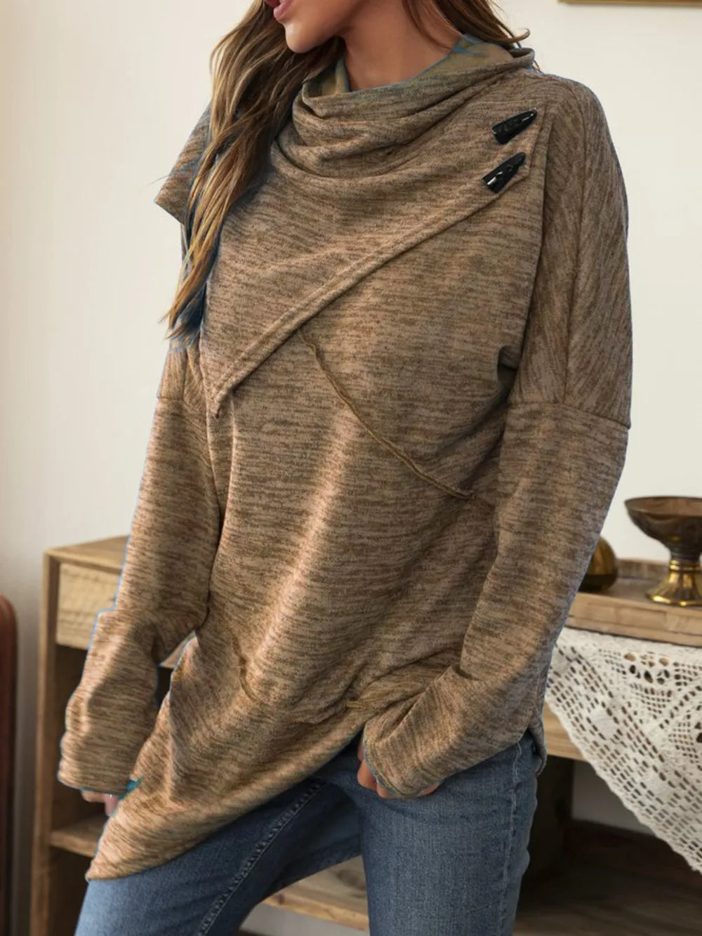 Asymmetrical hem cowl neck long sleeve T-shirt by Trendsi, featuring a stylish design and soft fabric, shown on a model.