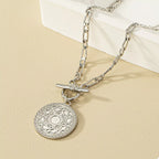 Chain link necklace with vintage coin pendant, stylish jewelry piece featuring a silver-toned design and intricate coin detail.