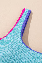 Threaded Pear Rory patchwork one-piece swimsuit with colorful, geometric design, featuring adjustable straps and classic fit.