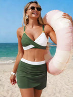 Women's two-tone cami and skort swim set by Trendsi, featuring stylish two-piece swimwear with a flattering fit and vibrant colors.