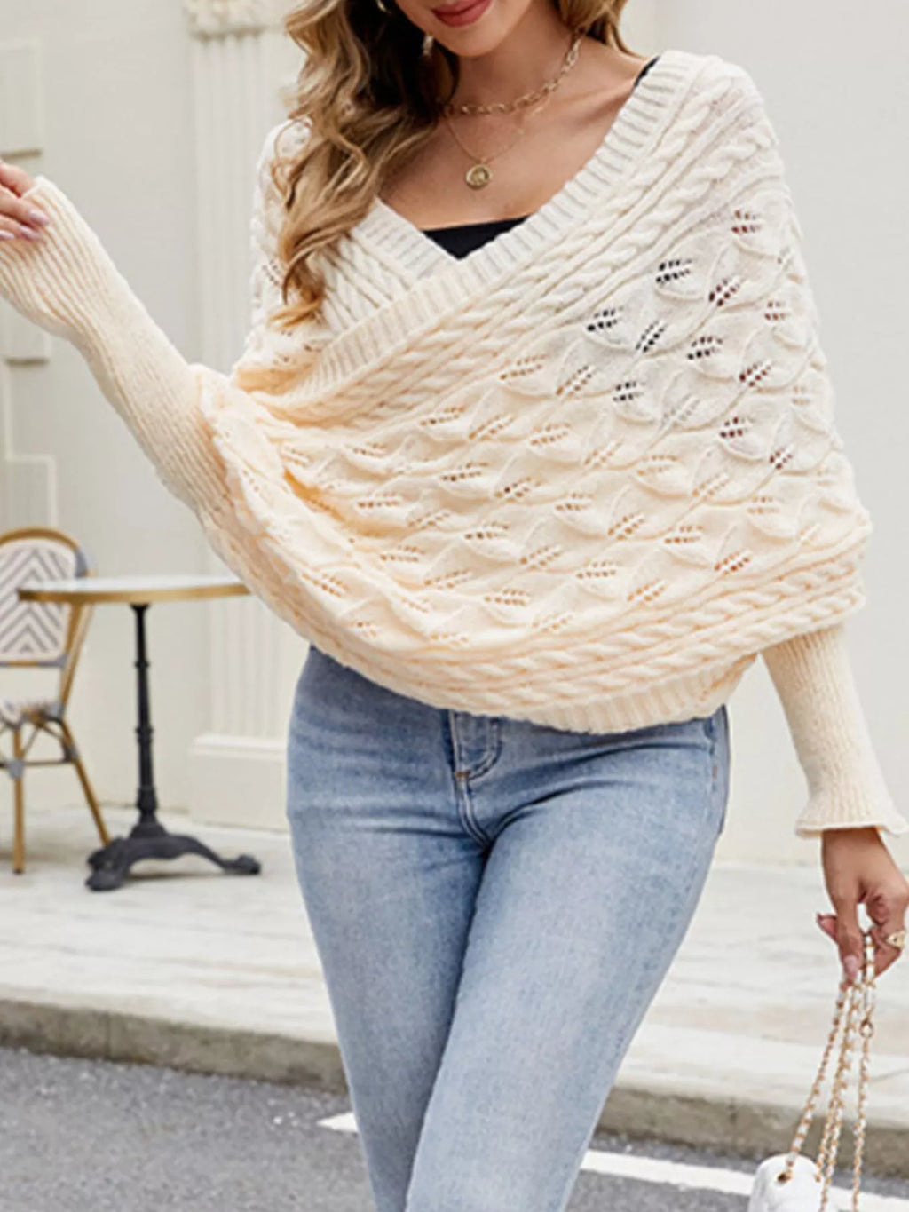 Cable knit batwing sleeve sweater from Trendsi, featuring a cozy textured design and relaxed fit, ideal for casual wear.
