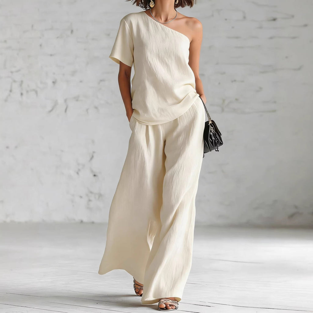 Women's wide-leg pants and top set from FitiqueFit, casualwear with three-quarter sleeves and relaxed fit.