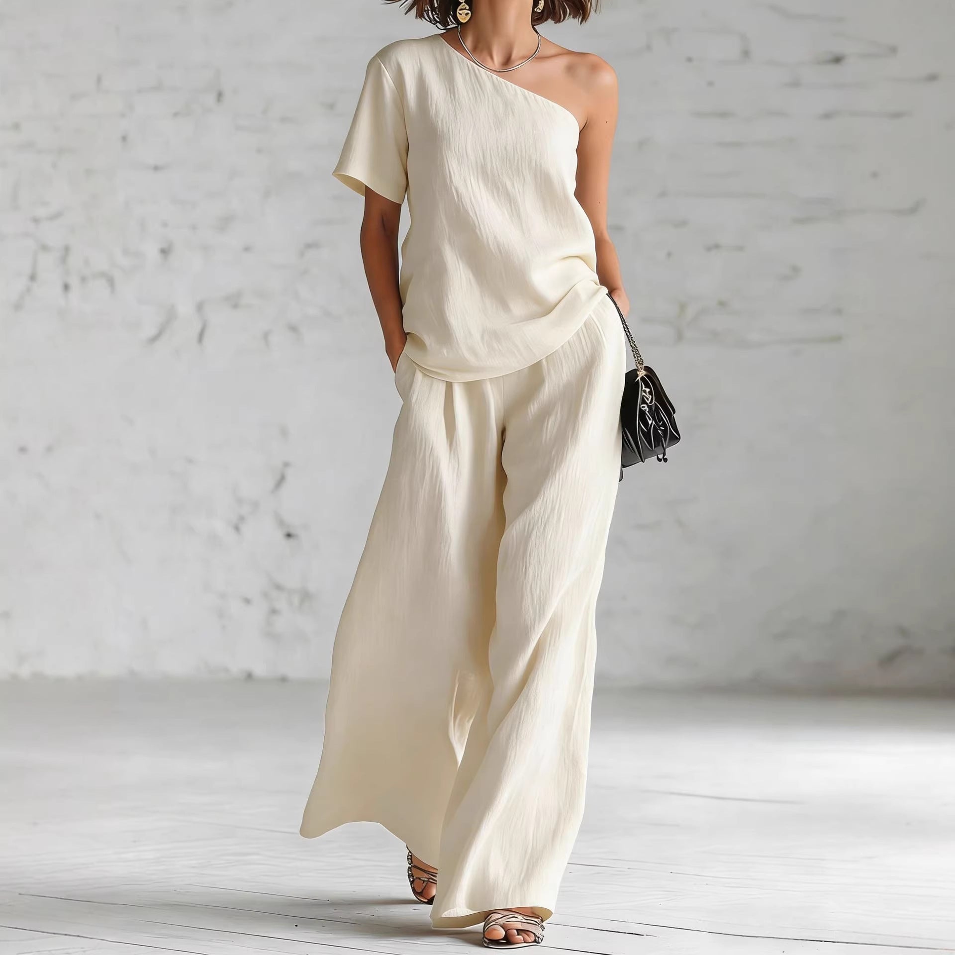 Women's wide-leg pants and top set from FitiqueFit, casualwear with three-quarter sleeves and relaxed fit.