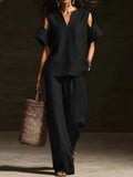 FitiqueFit two-piece V-neck short sleeve top and straight-leg pants set with ripped details, pockets, in a solid color.