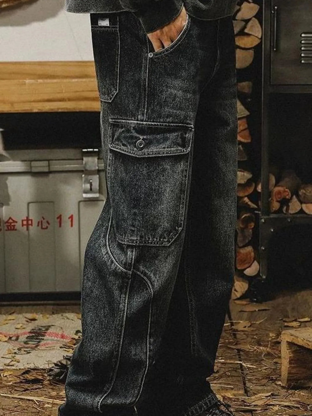 Men's washed wide leg cargo jeans by Trendsi, showing relaxed fit with multiple cargo pockets and distressed denim finish.