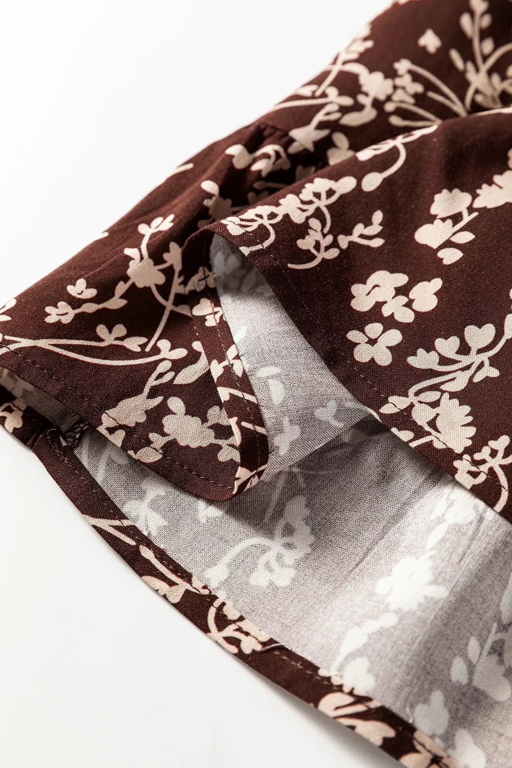 Plush Fashion Hub ditsy floral print mini dress with split neck, long sleeves, shirred waist, and flared hem.