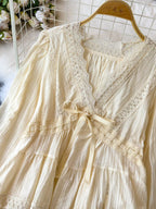 Lace detail v-neck blouse from Trendsi, styled as a dress, featuring elegant lace accents and a flattering V-neck design.