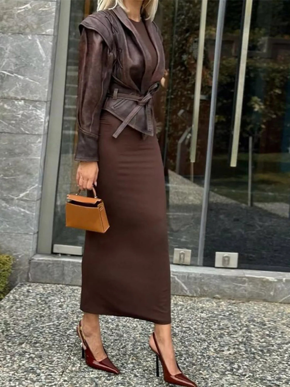 Women's leather belted jacket with shawl collar, stylish outerwear by Trendsi, featuring a sleek design and classic silhouette.