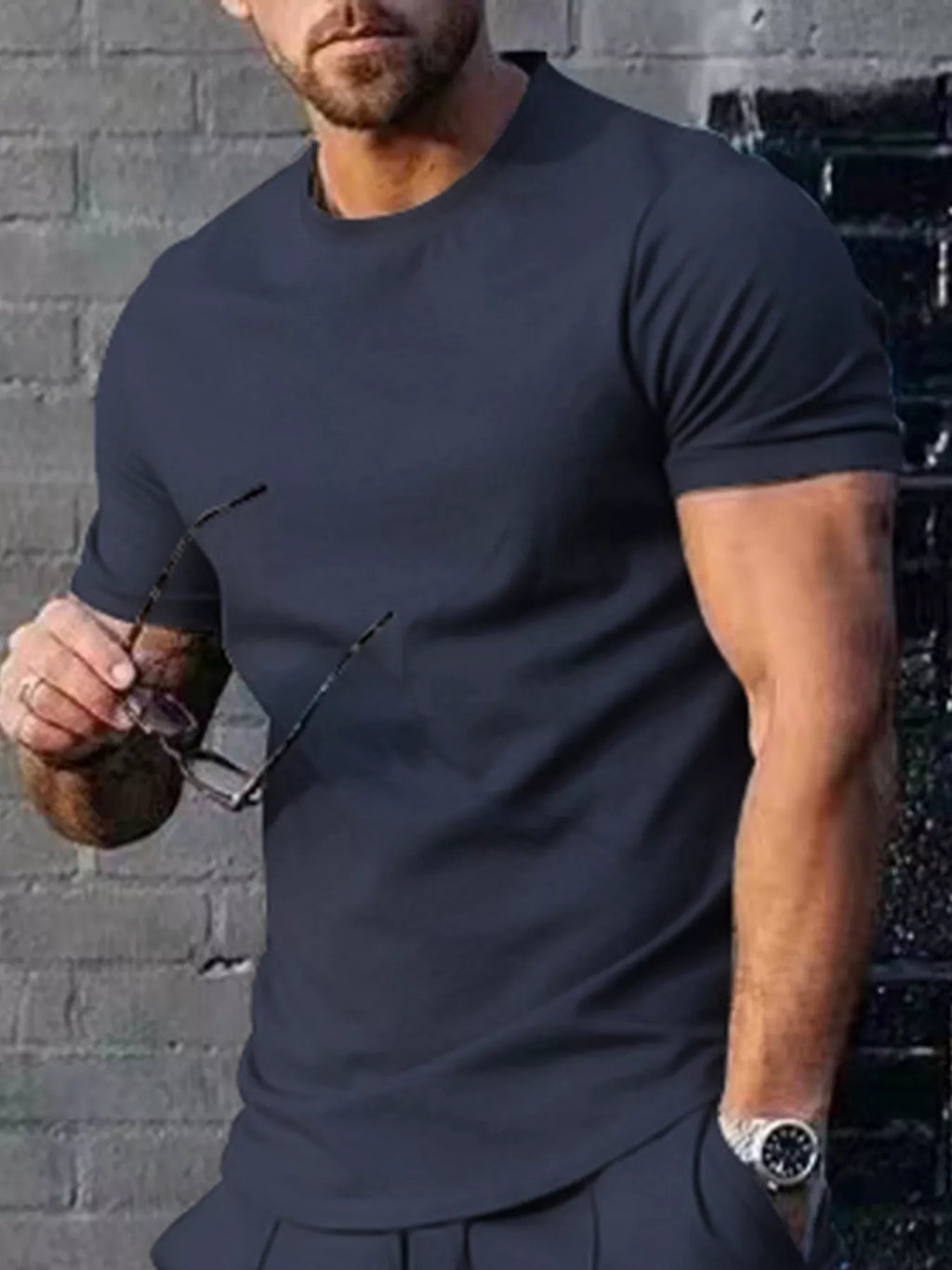 Men's plus size solid color casual T-shirt from Trendsi, featuring a comfortable fit and short sleeves, shown in navy blue.