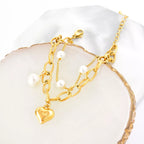 18K gold-plated heart charm bracelet featuring delicate links and sparkling heart pendants, stylish jewelry piece.