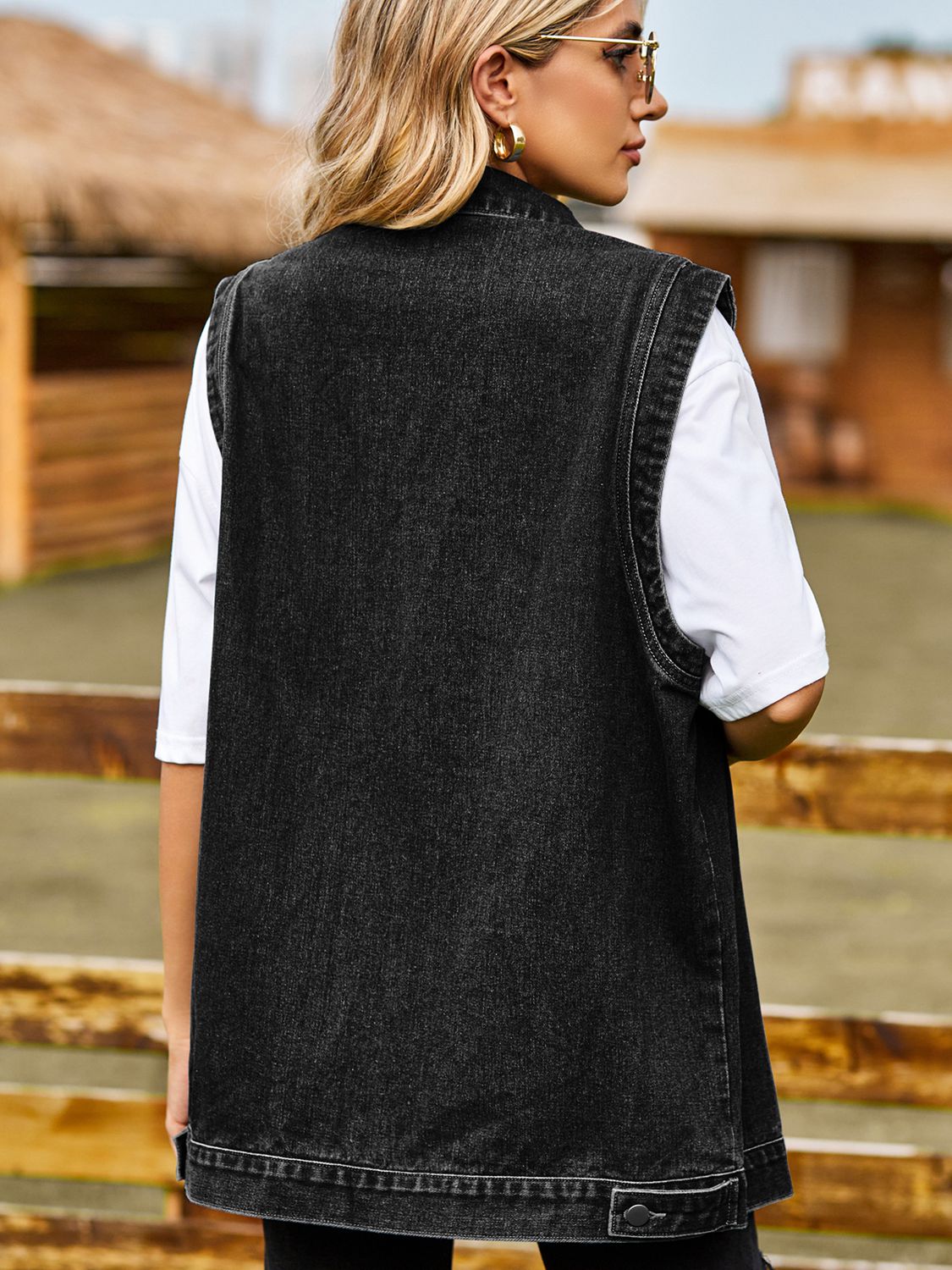 VYSN button down denim vest with classic collar and sleeveless design, shown in light blue denim fabric.