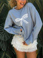Women's cute kitten graphic sweatshirt from Plush Fashion Hub, featuring a playful kitten design on cozy streetwear style.