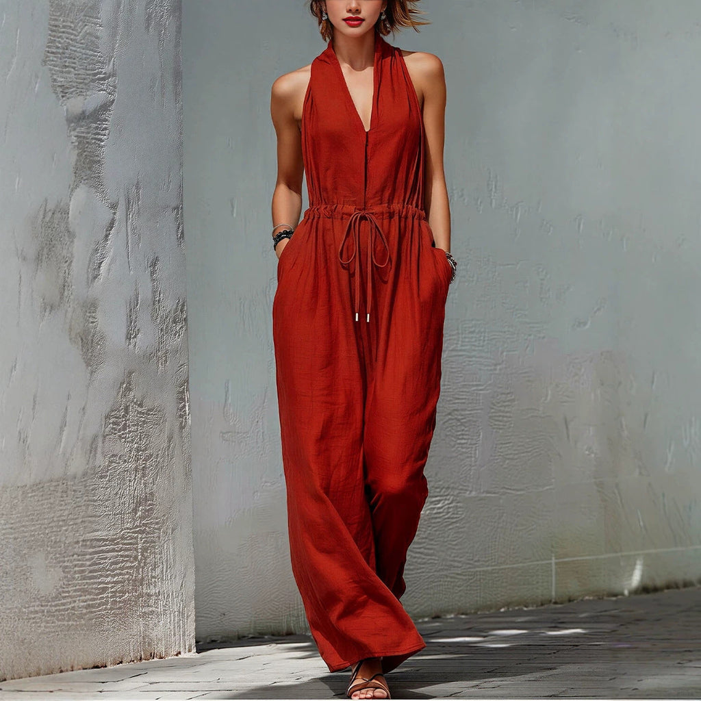 Women's sleeveless halter neck long jumpsuit in solid color, casualwear from Plush Fashion Hub, shown on a model.
