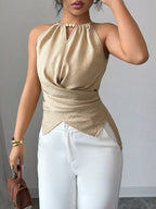 Black halter neck crisscross cami tank top by Plush Fashion Hub, featuring stylish straps and fitted design.