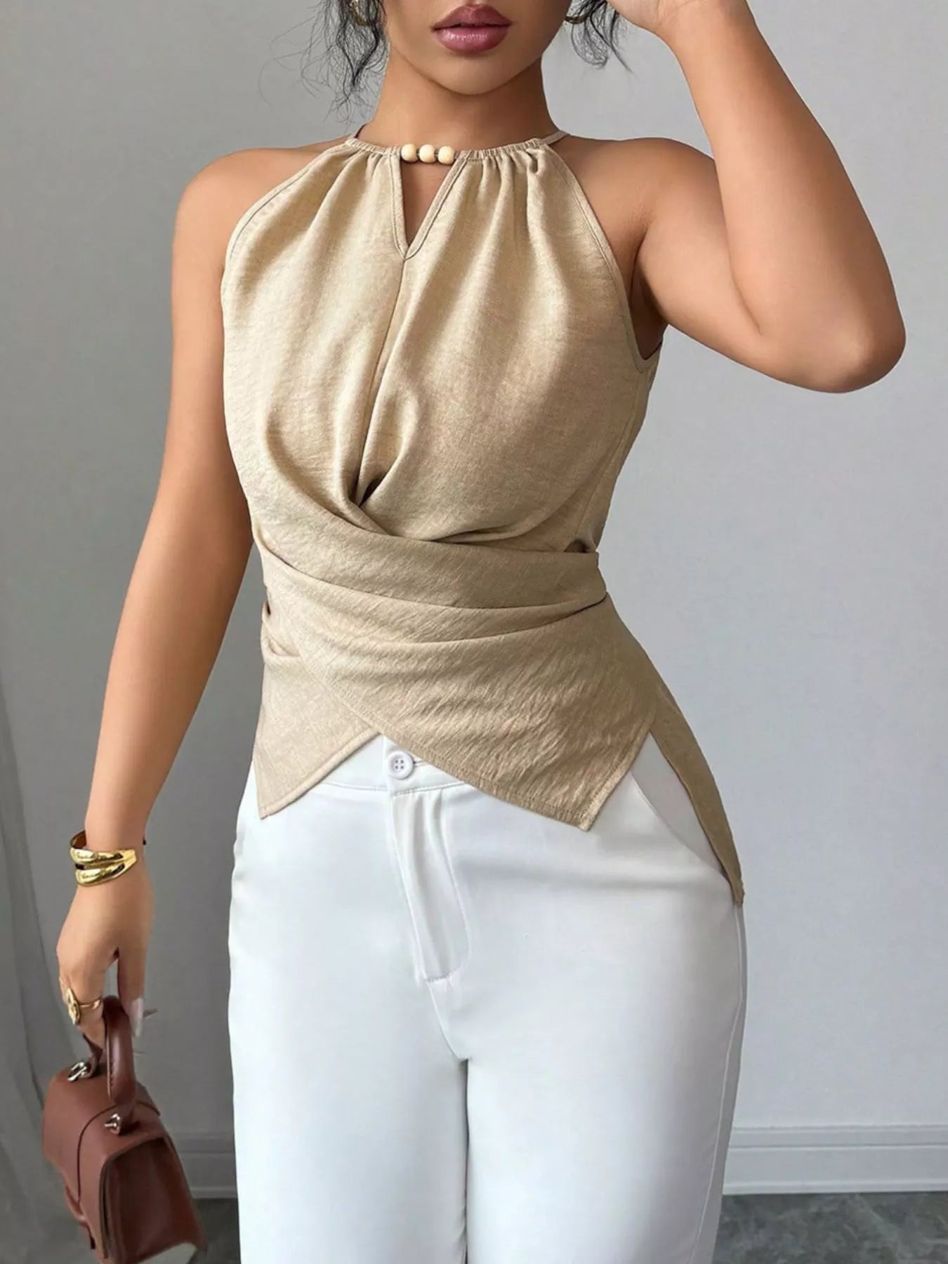 Black halter neck crisscross cami tank top by Plush Fashion Hub, featuring stylish straps and fitted design.