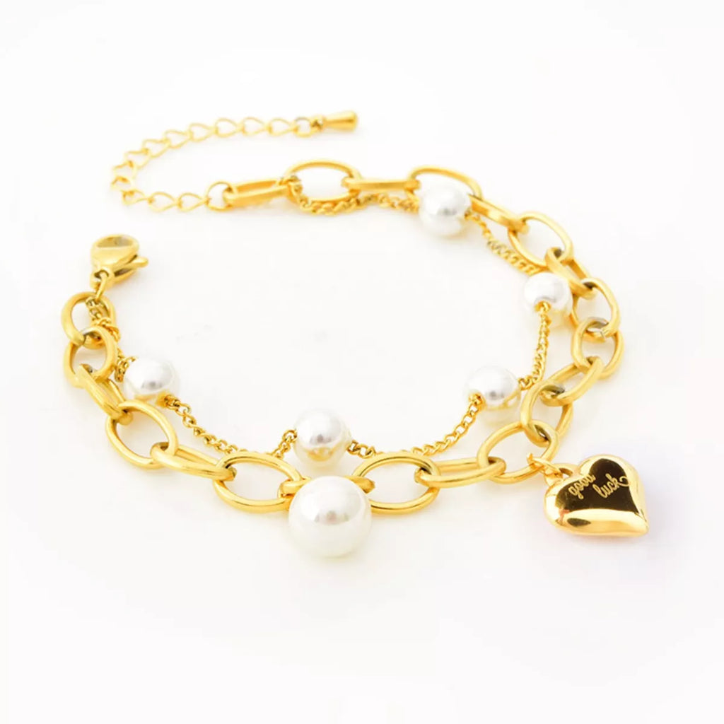 18K gold-plated heart charm bracelet with delicate chain and stylish design, perfect for elegant jewelry collection.