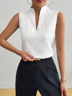 Women’s textured sleeveless tank top with notched neckline, versatile basic shell by Trendsi, shown in a close-up view.